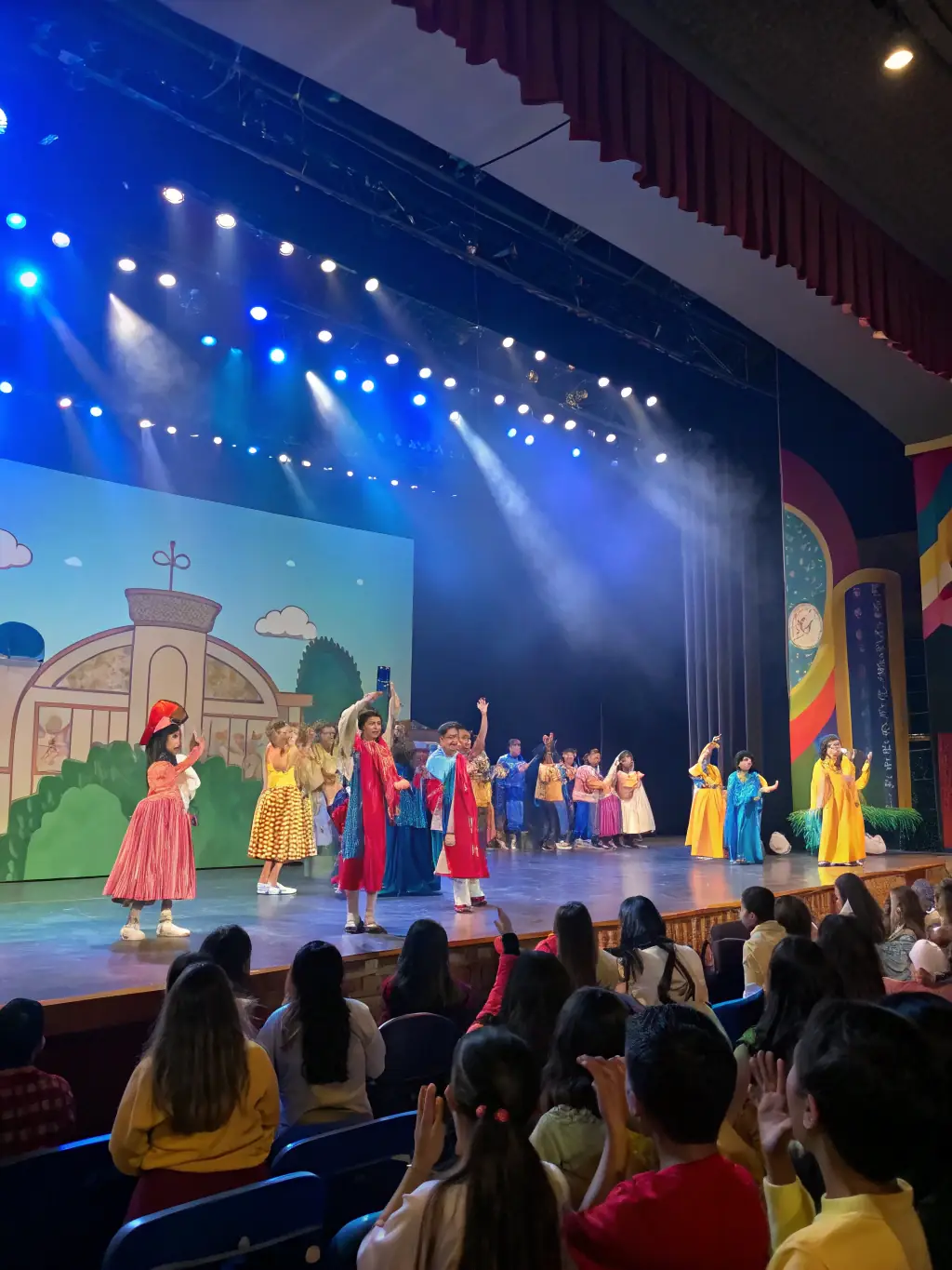 A dynamic image of students performing in a school play organized by FAPEV, highlighting the talent and dedication of the students.