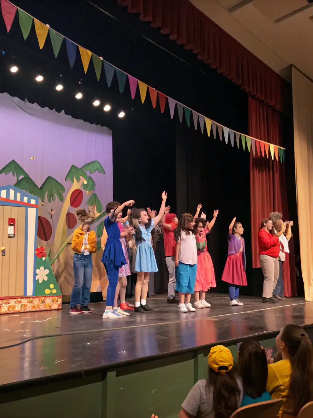 A photograph of students performing in a school play coordinated by FAPEV, highlighting their teamwork and theatrical skills.
